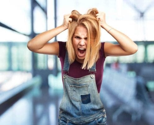 What do anger signs look like - Women pulling on hair